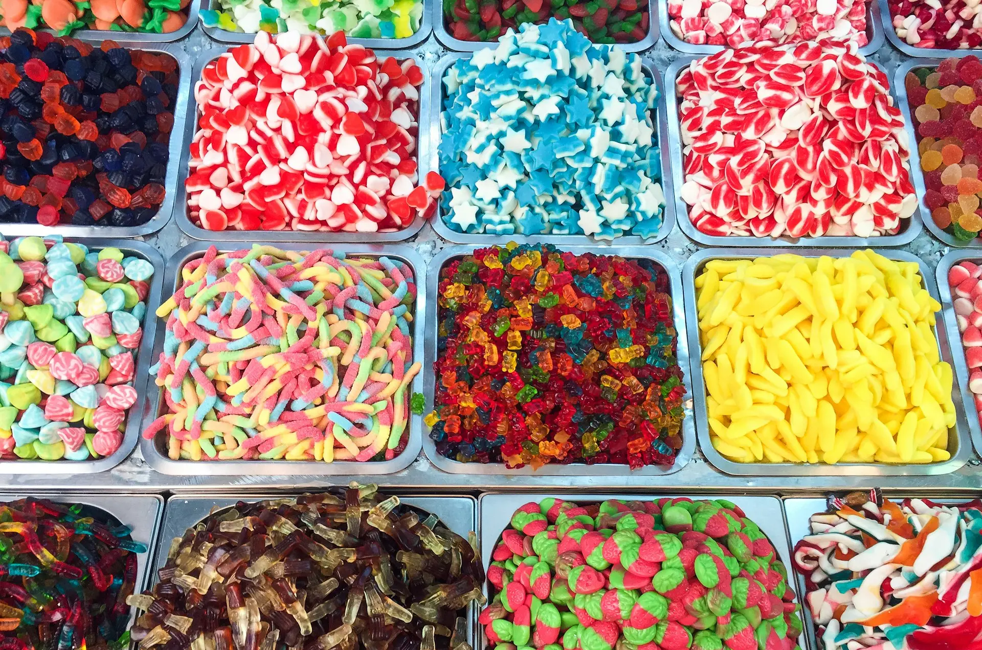 assorted candies in plastic containers